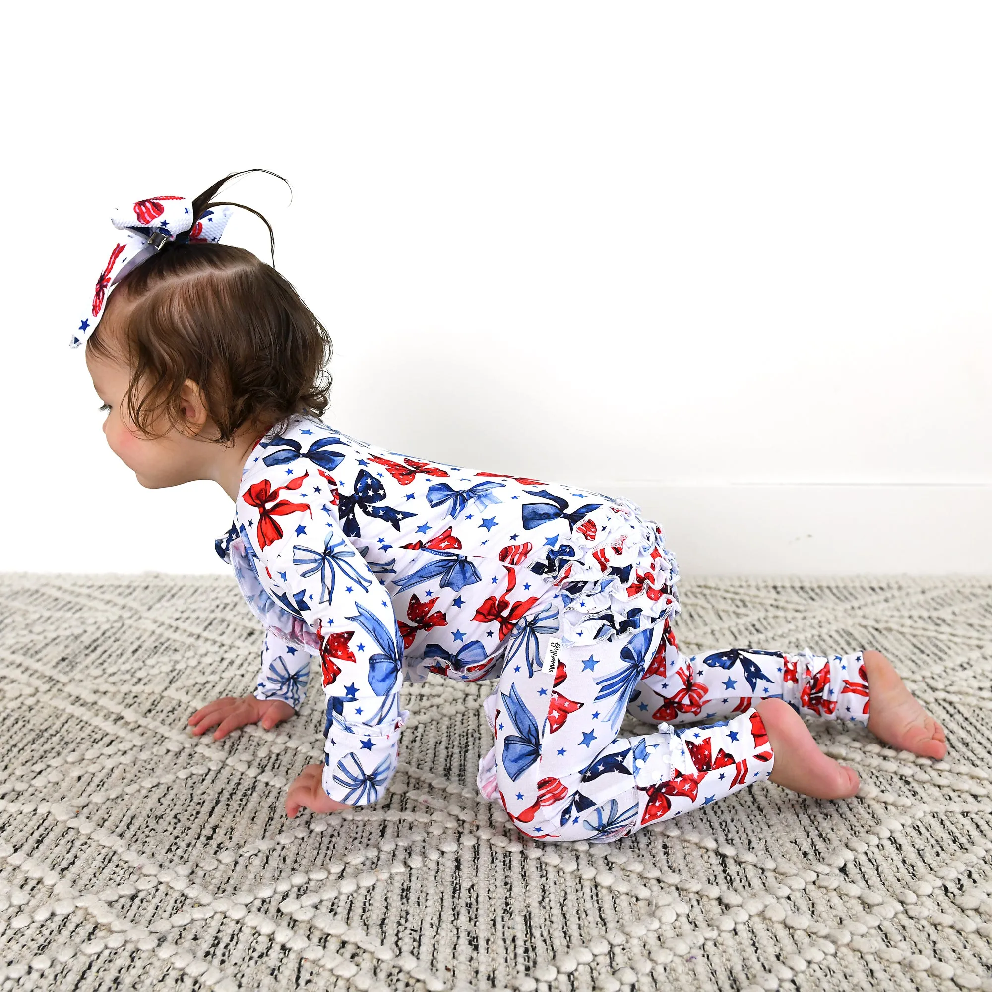 Eleanor Bows RUFFLE ZIP