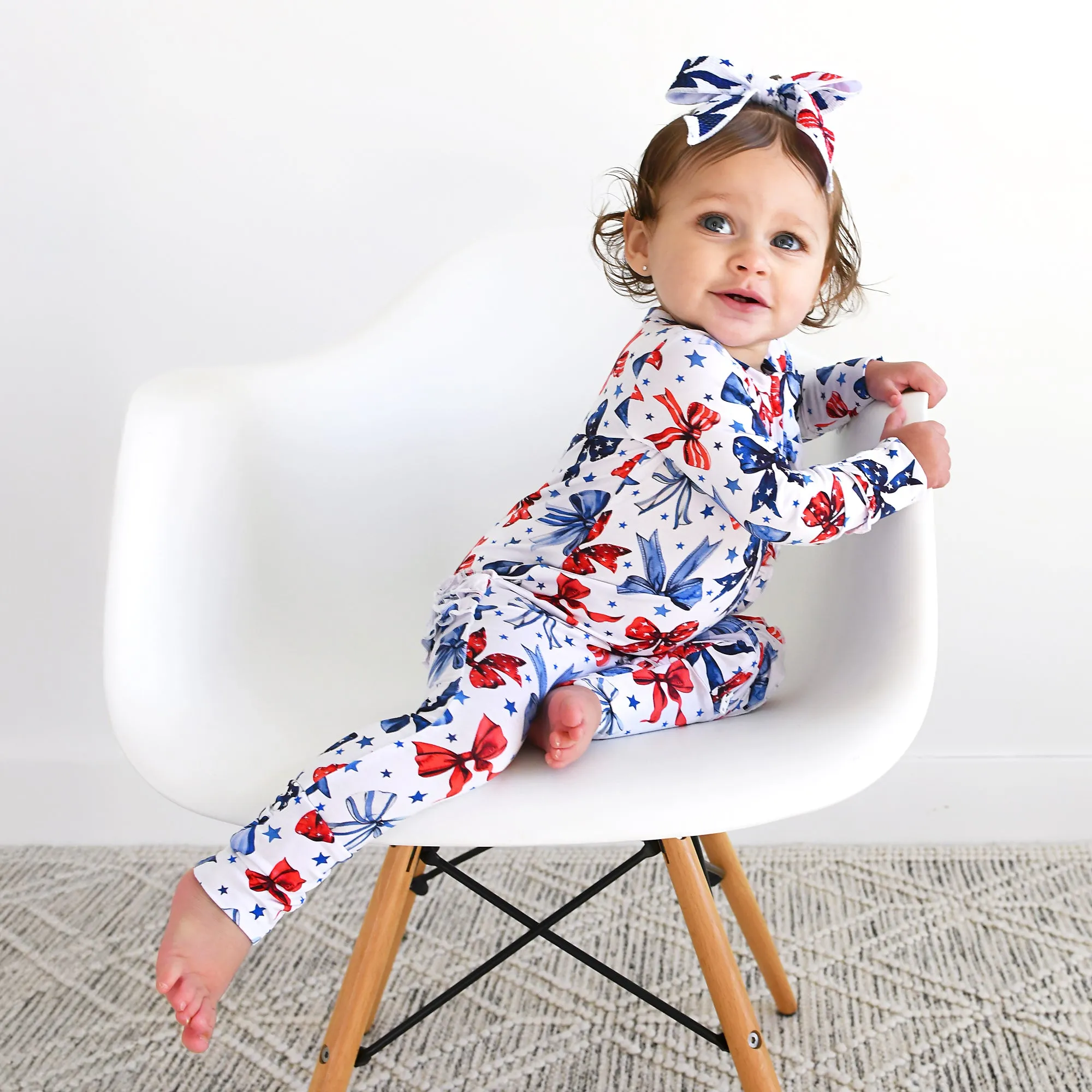 Eleanor Bows RUFFLE ZIP