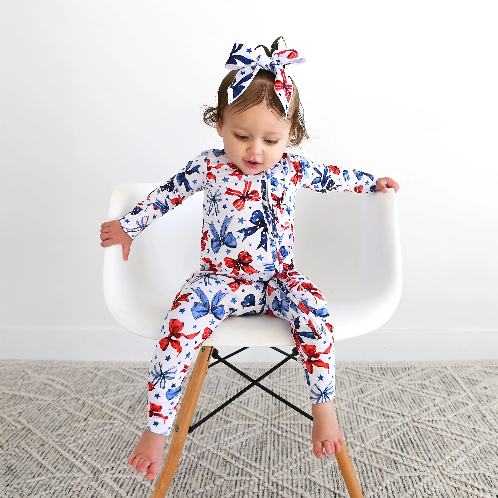 Eleanor Bows RUFFLE ZIP