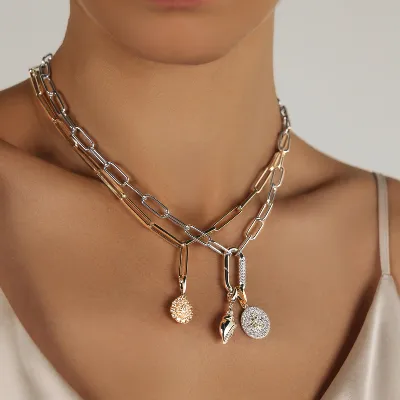 Fancy pendant with 0.95 carats* of diamond simulants in 10 carat yellow gold and sterling silver